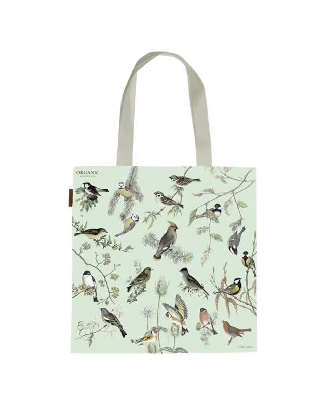 Eine Bio-Baumwolltasche „Gartenvögel“ von Koustrup & Co. in Mintgrün mit handgezeichneten Vögeln auf Zweigen und Blättern, zwei Tragriffe und einem kleinen Lederetikett.