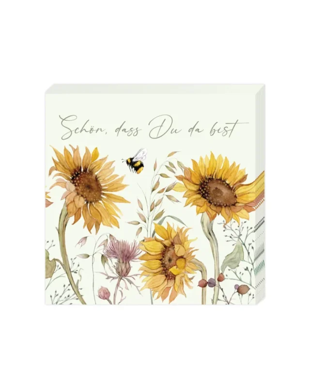 Die Verpackung der Cocktailservietten „Sonnenblumen“ vom Grätz Verlag. Zu sehen sind Sonnenblumen, Bienen und der Spruch „Schön, dass Du da bist“.