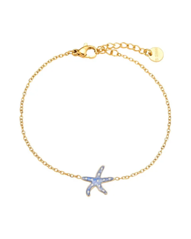 Goldenes Armband "Emaille" von Dottilove vor weißen Hintergrund. Das Armband hat unten einen kleinen Seestern Anhänger mit weißen Punkten auf dem Rücken und besteht aus Edelstahl.