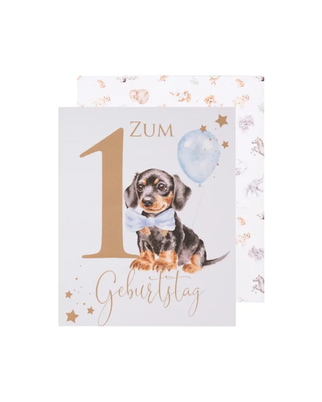 Hundewelpen Geburtstagsarte von Wrendale Designs vor weißen Hintergrund. Das Motiv ist ein süßer Welpe welcher eine Fliege trägt und ein Luftballon hält. Auf der Karte ist die Aufschrift "zum Geburtstag".