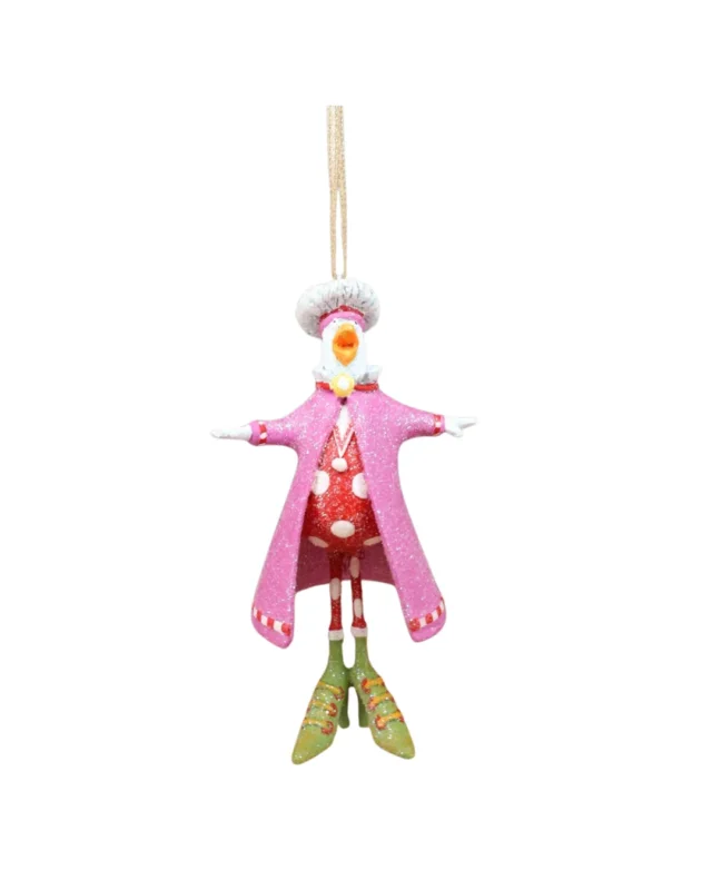 „Mini Calling Bird Krinkle von Patience Brewster – pink gekleideter Vogel mit weißem Federhut und grünen Schuhen, frontal fotografiert.“