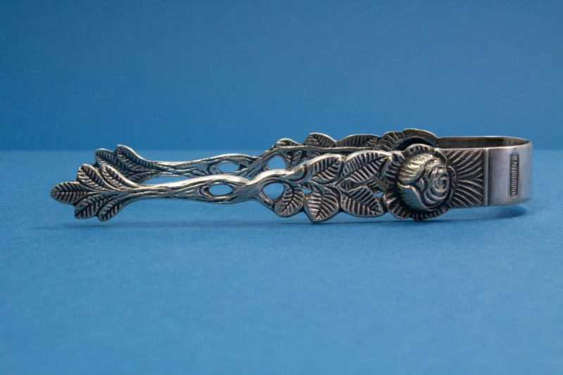 Silver plated sugar tongs with roses