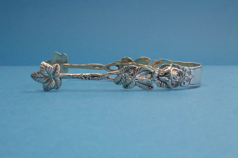 Silver plated sugar tongs with roses